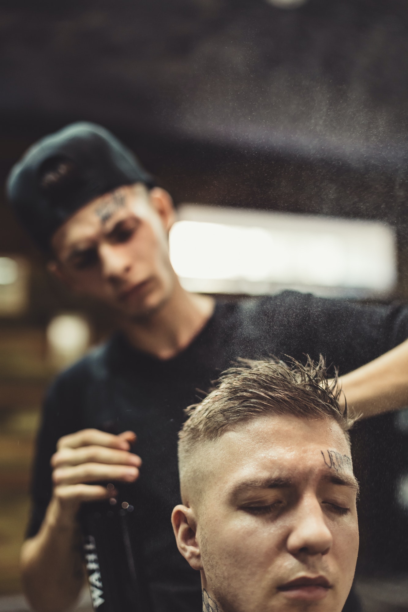 stylist-grooming-client-in-barbershop.jpg